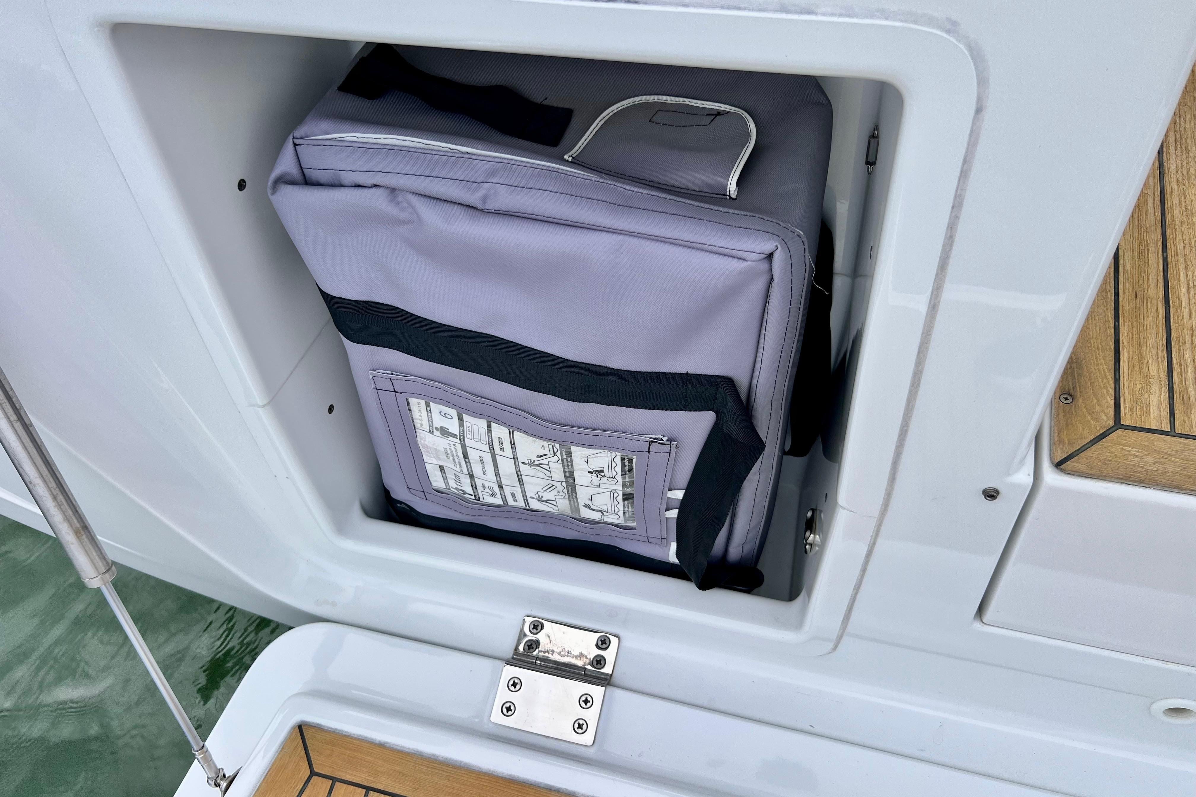 Storage compartment on a 2016 Hanse 455 yacht with a neatly packed bag.