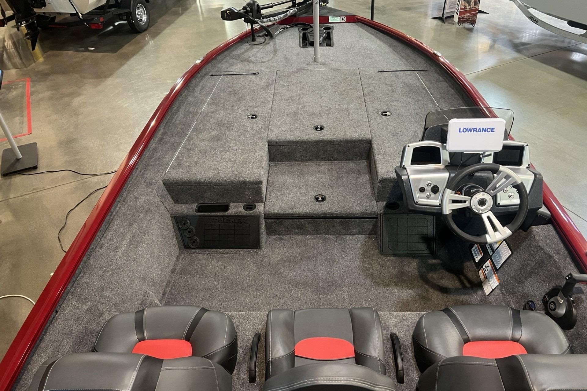 2025 Tracker Savage 215 boat interior with steering wheel, seats, and Lowrance navigation system.