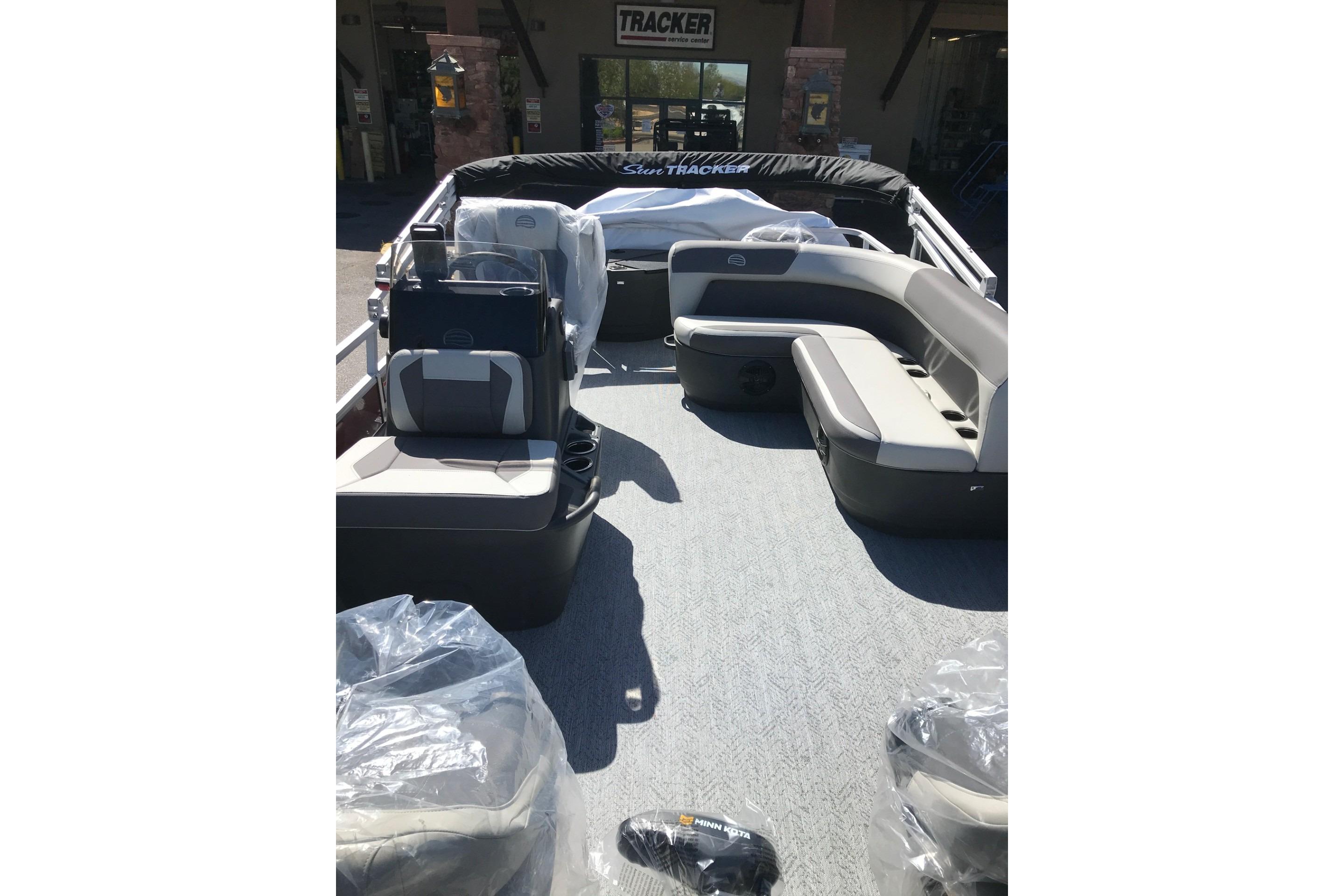 2026 Sun Tracker Bass Buggy 18 DLX pontoon boat interior with seating and console.