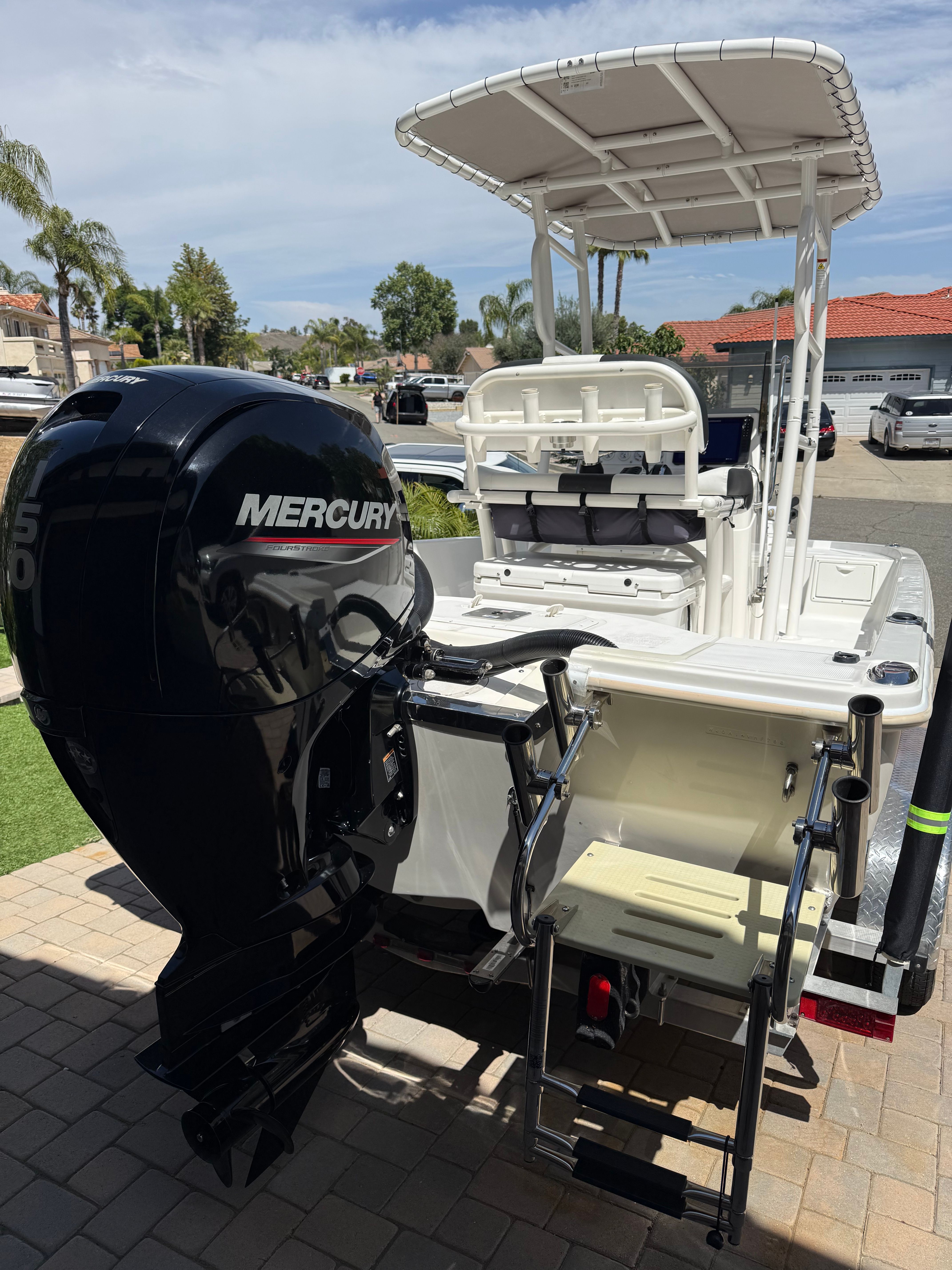 1998 Robalo 2100 Bay Hunter with Mercury engine, parked on a trailer.