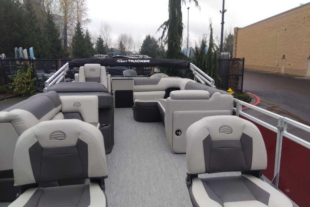 2026 Sun Tracker Fishin' Barge 22 DLX pontoon boat with spacious seating and modern design.