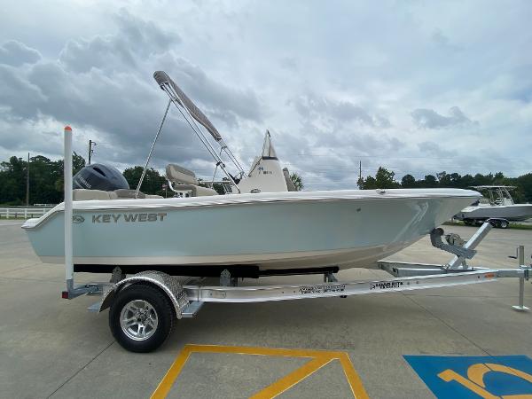 2024 Key West 189 FS boat on a trailer in a parking lot.