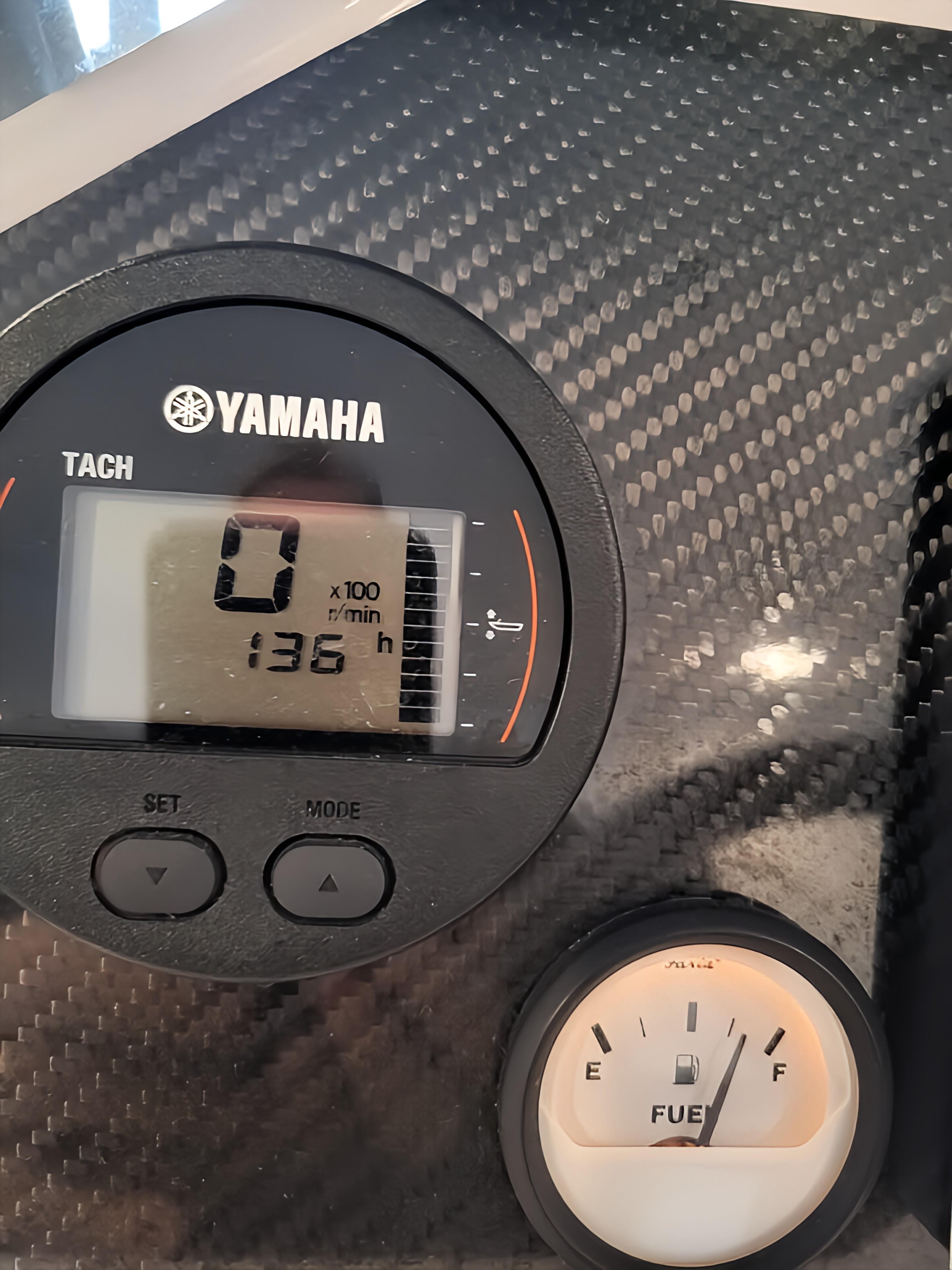 Yamaha tachometer and fuel gauge on 2023 Highfield Sport 420 boat dashboard.