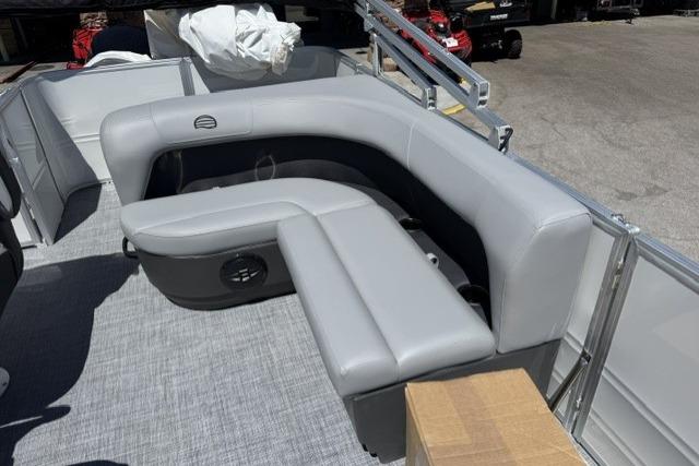 2026 Sun Tracker Party Barge 18 DLX with gray seating and spacious deck layout.