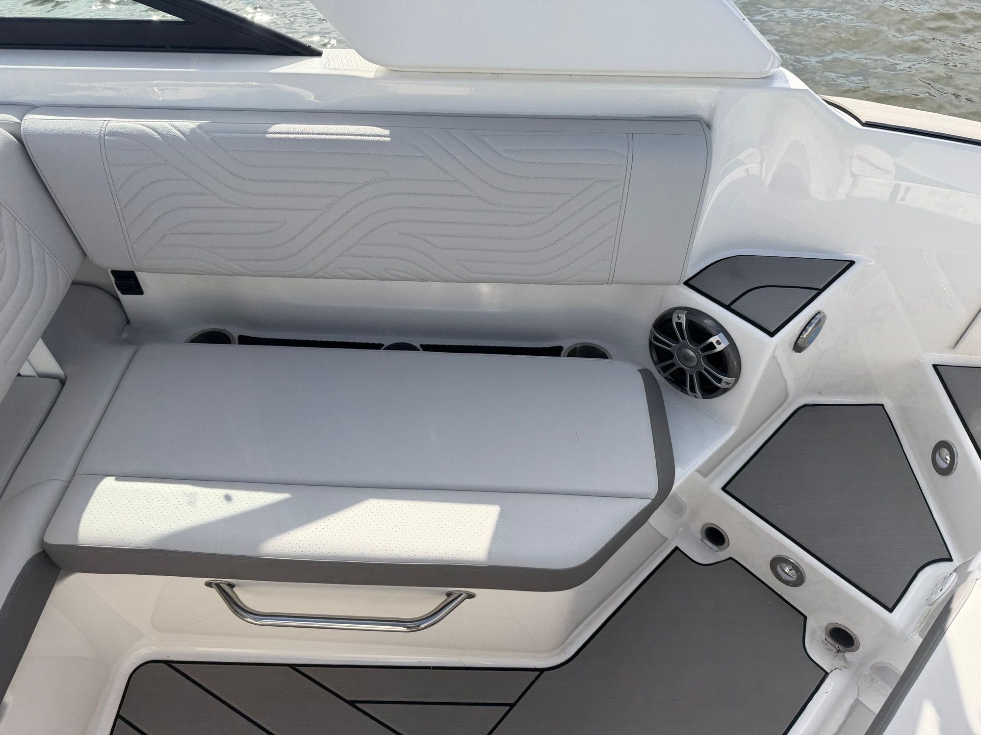 Interior of 2025 Sea Ray SDX 270 Surf with gray upholstery.