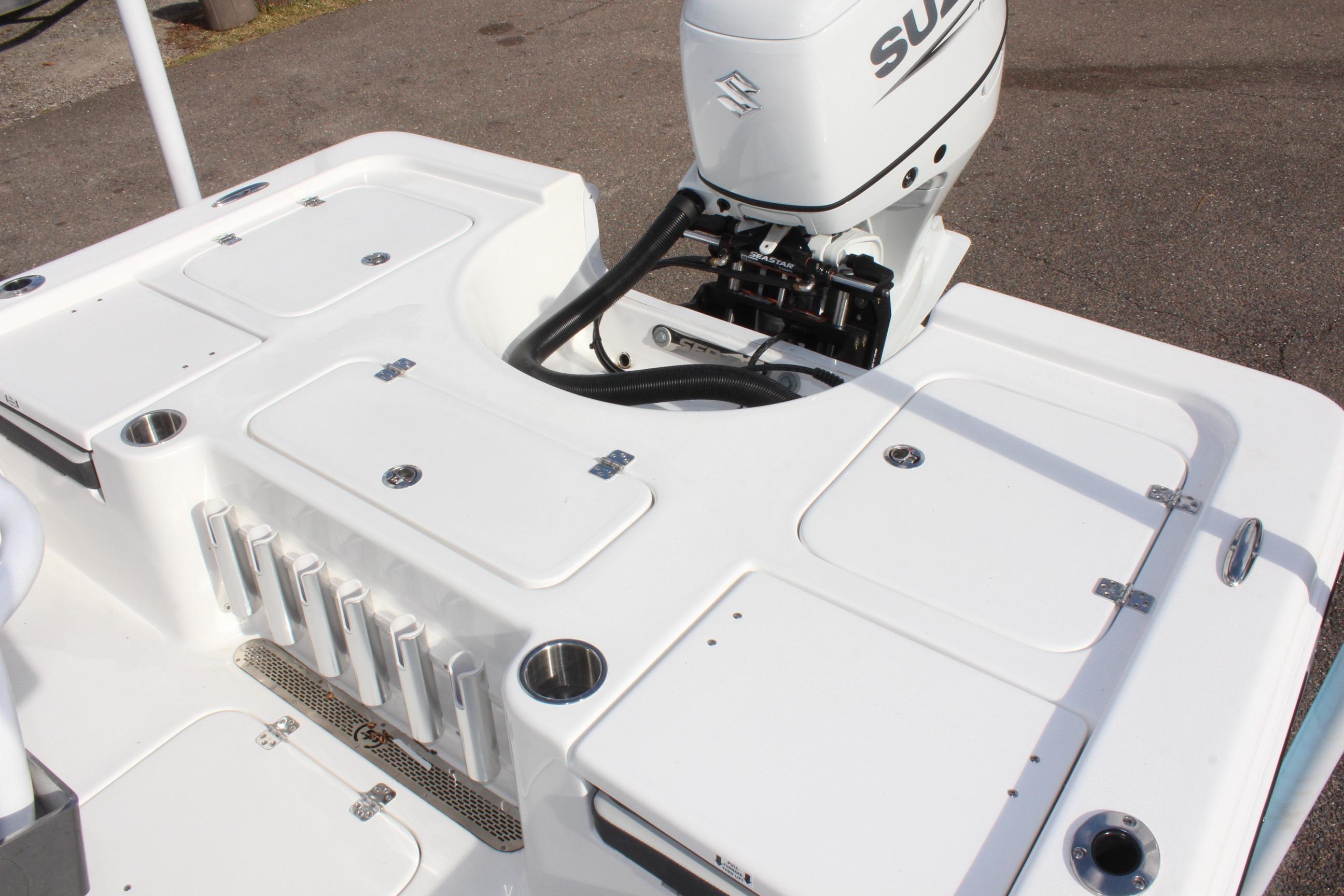 2025 Sea Pro 230 Bay boat with Suzuki outboard motor, featuring spacious deck layout.