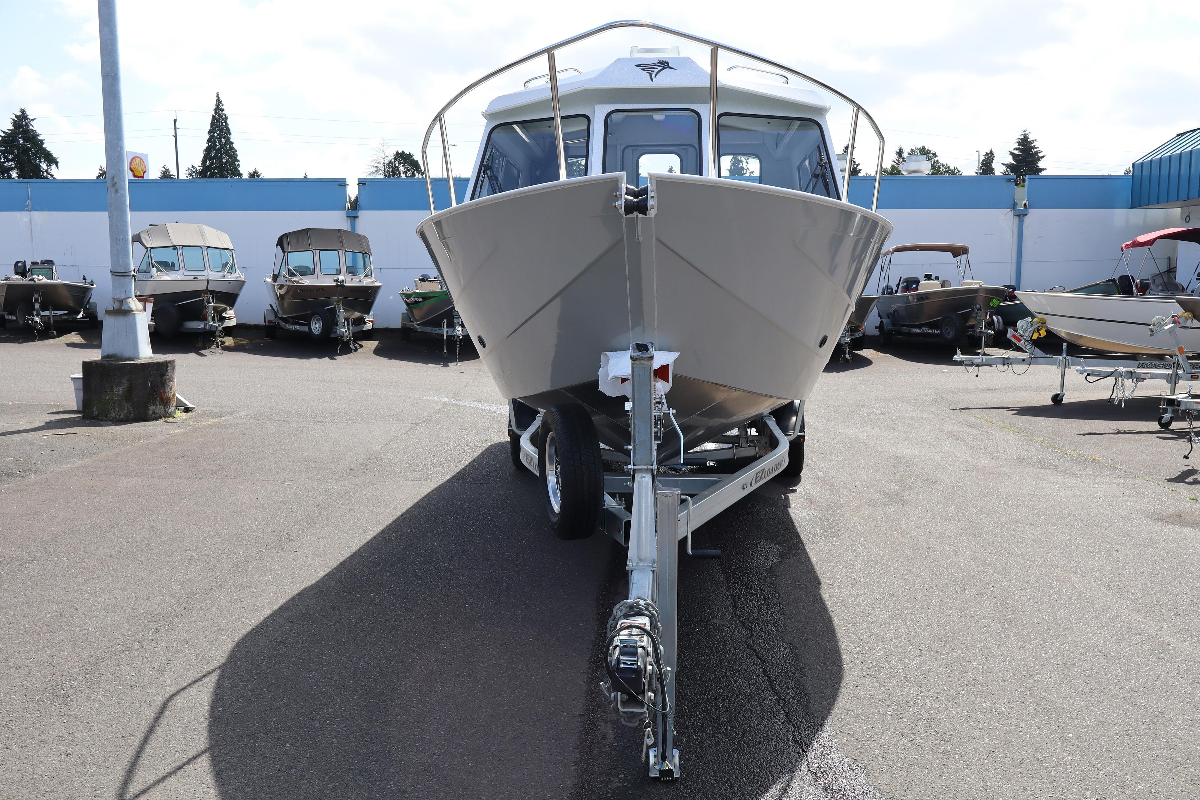 2026 KingFisher 2425 Escape HT boat on trailer in dealership lot.