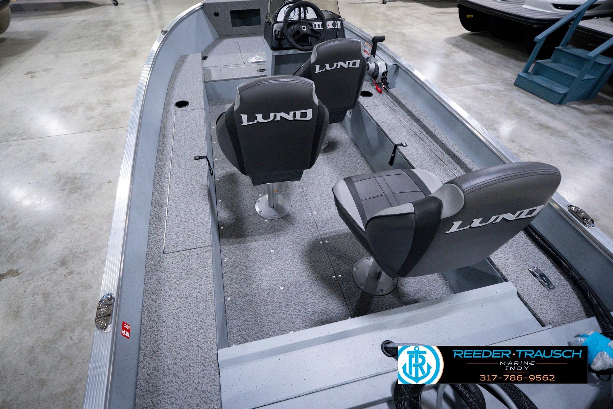 2026 Lund 1600 Fury SS boat interior with two seats and steering console.