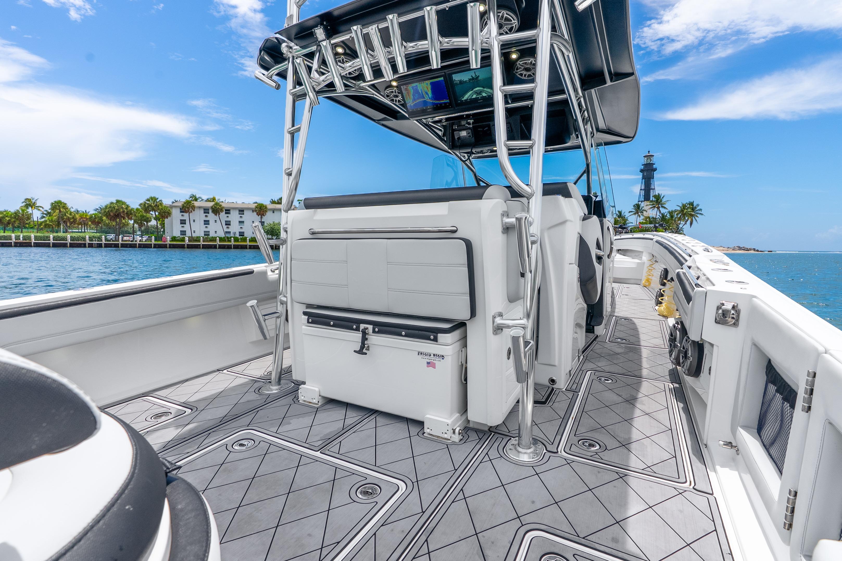 2024 Nor-Tech 452 Super Fish boat interior with ocean view and lighthouse in background.