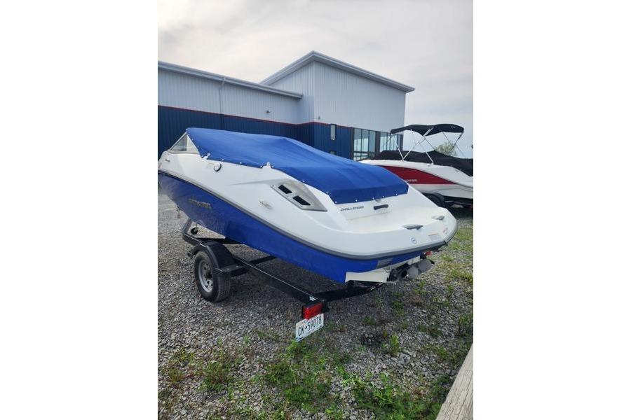2012 Sea-Doo Sport Boats 180 Challenger with blue cover on trailer.