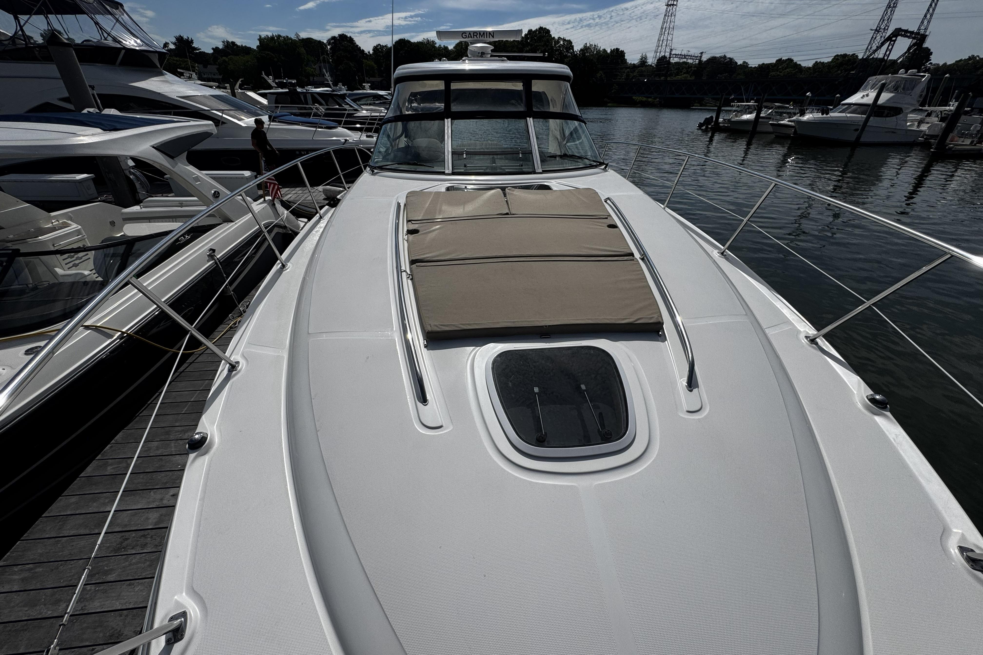 2006 Sea Ray 40 Sundancer yacht docked, featuring spacious deck and sleek design.