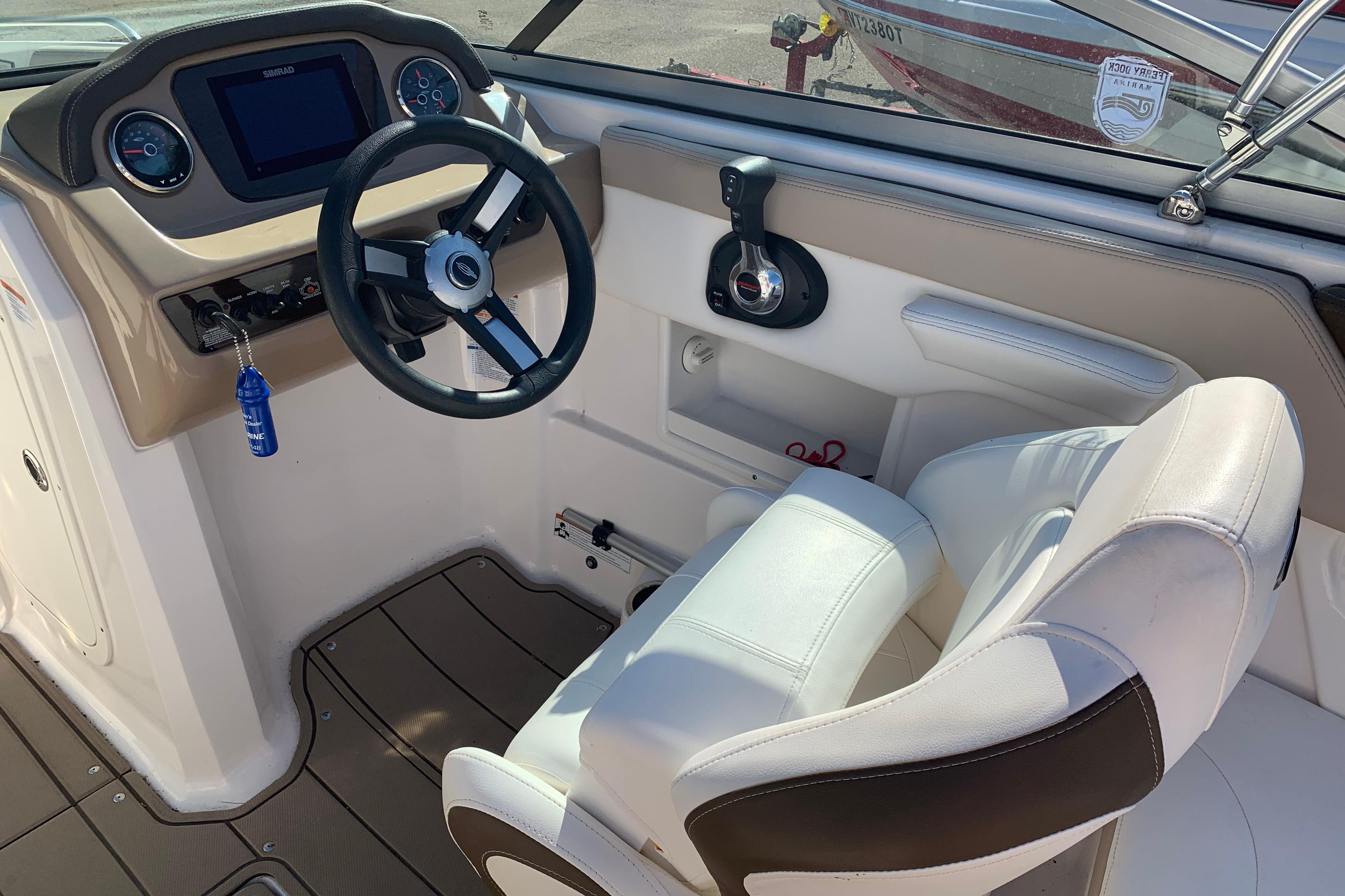 2022 Chaparral 23 SSi boat interior with steering wheel and dashboard controls.