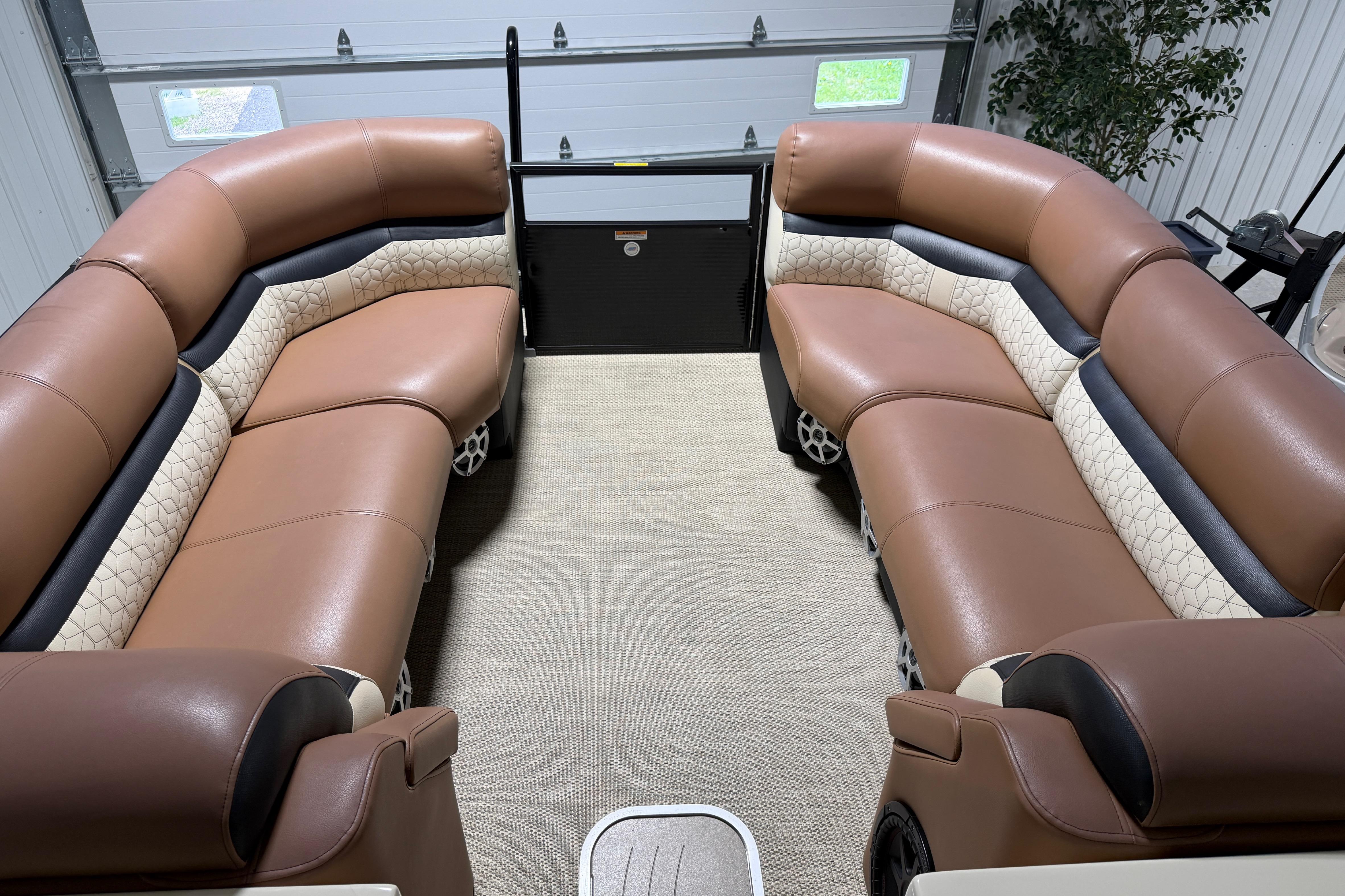Luxurious interior of a 2018 Godfrey Sanpan 2500 ULC pontoon boat with plush seating.