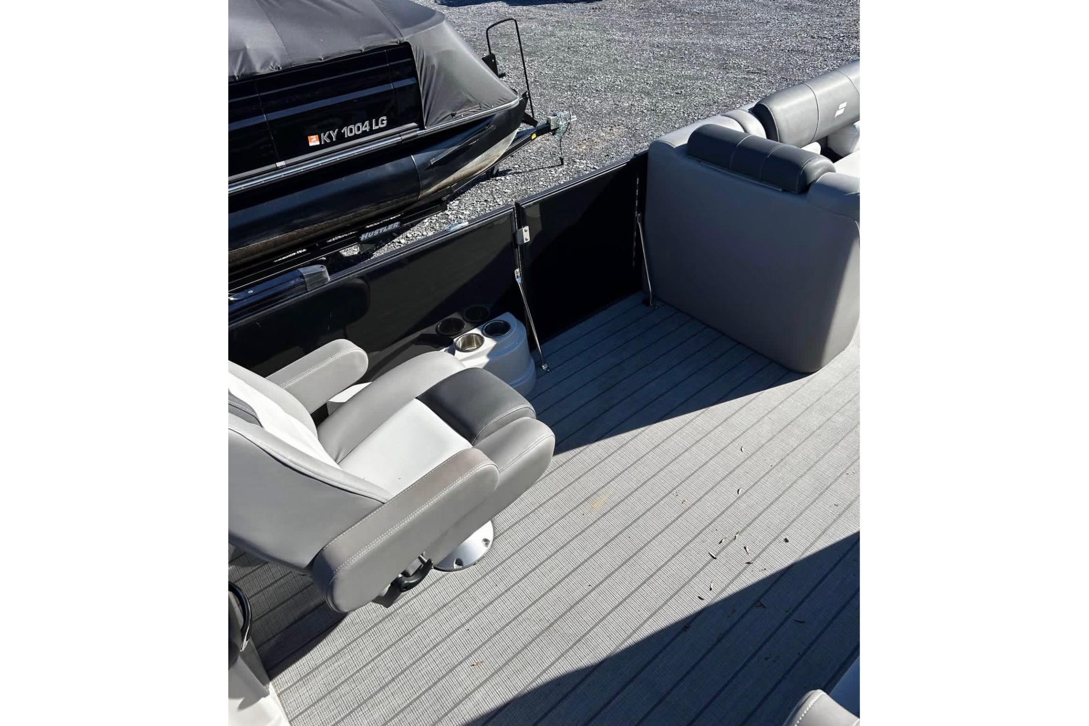 2023 Starcraft MX 25 DL DH boat interior with gray seating and flooring.