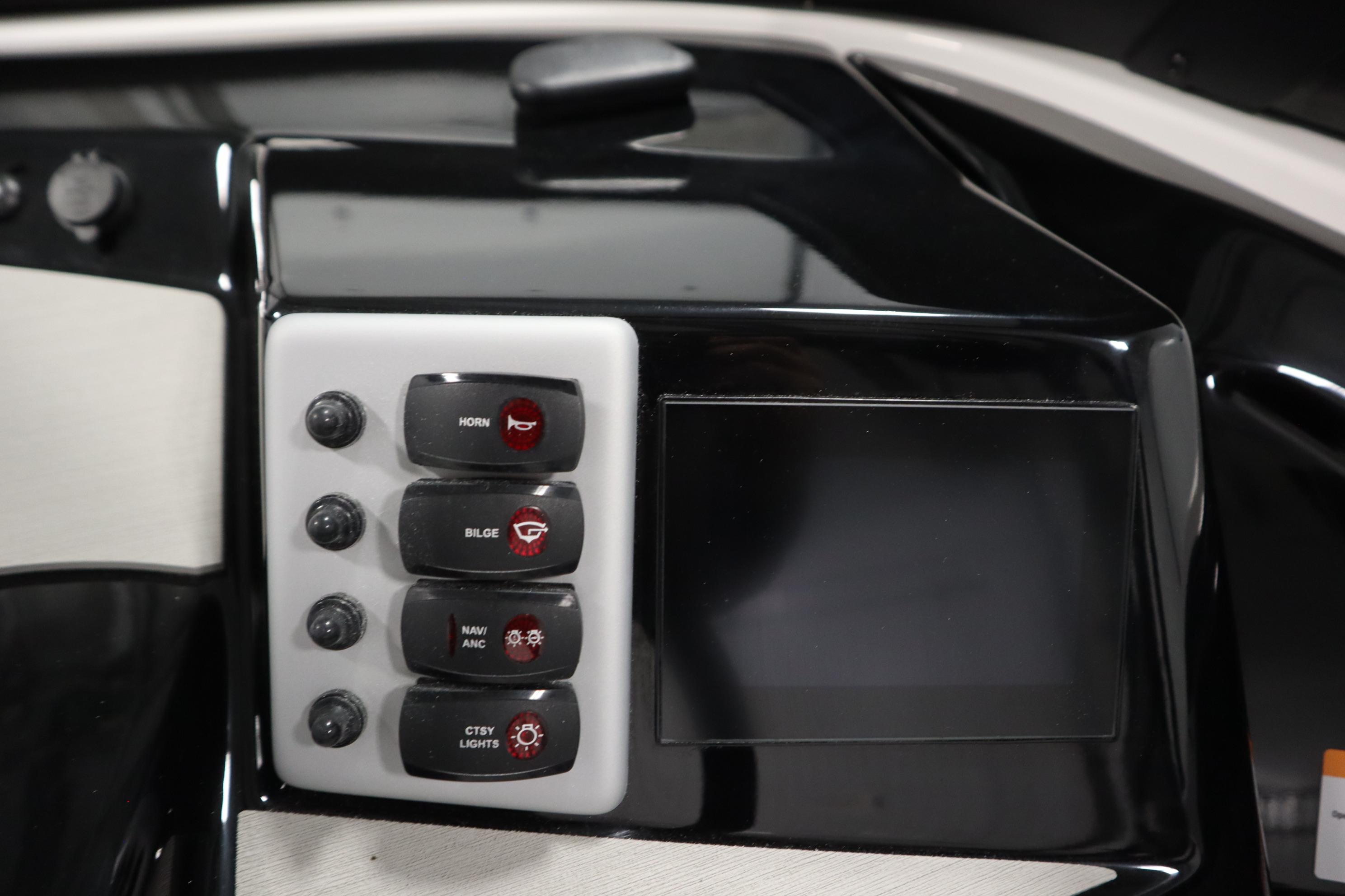 Control panel of 2026 Yamaha Boats AR220 with switches and display screen.