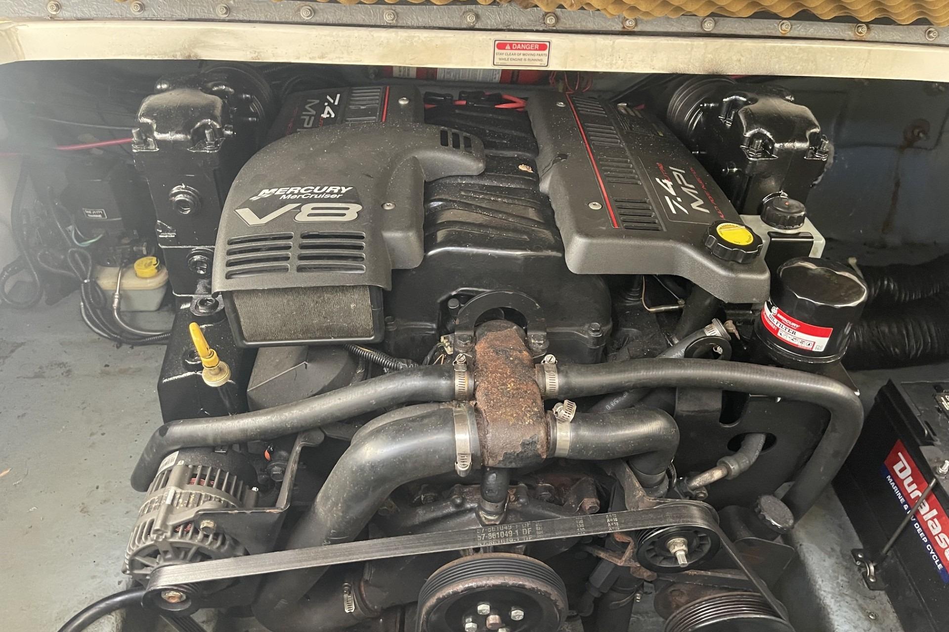 Engine compartment of a 2000 Sea Ray Sundancer 260 with Mercury V8 engine.