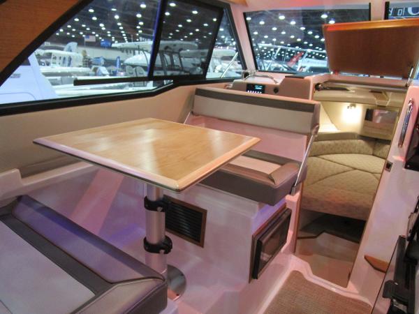 Interior of 2025 Cutwater C-248 Coupe, featuring a cozy dining area and modern design.