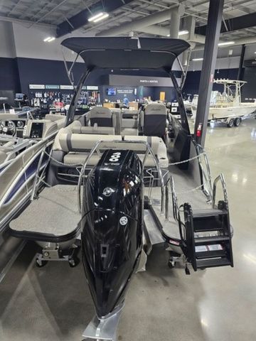 2025 Barletta Boats R23UCA pontoon boat displayed in a showroom.