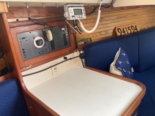 Interior of a 1989 Catalina 30 sailboat with navigation equipment and seating area.