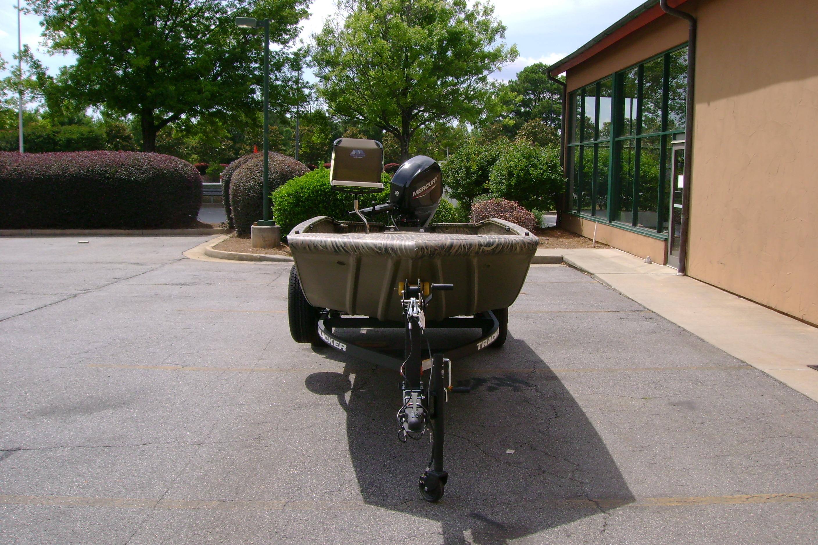 2026 Tracker Grizzly 1650 T Prairie Wings Edition boat parked outdoors.