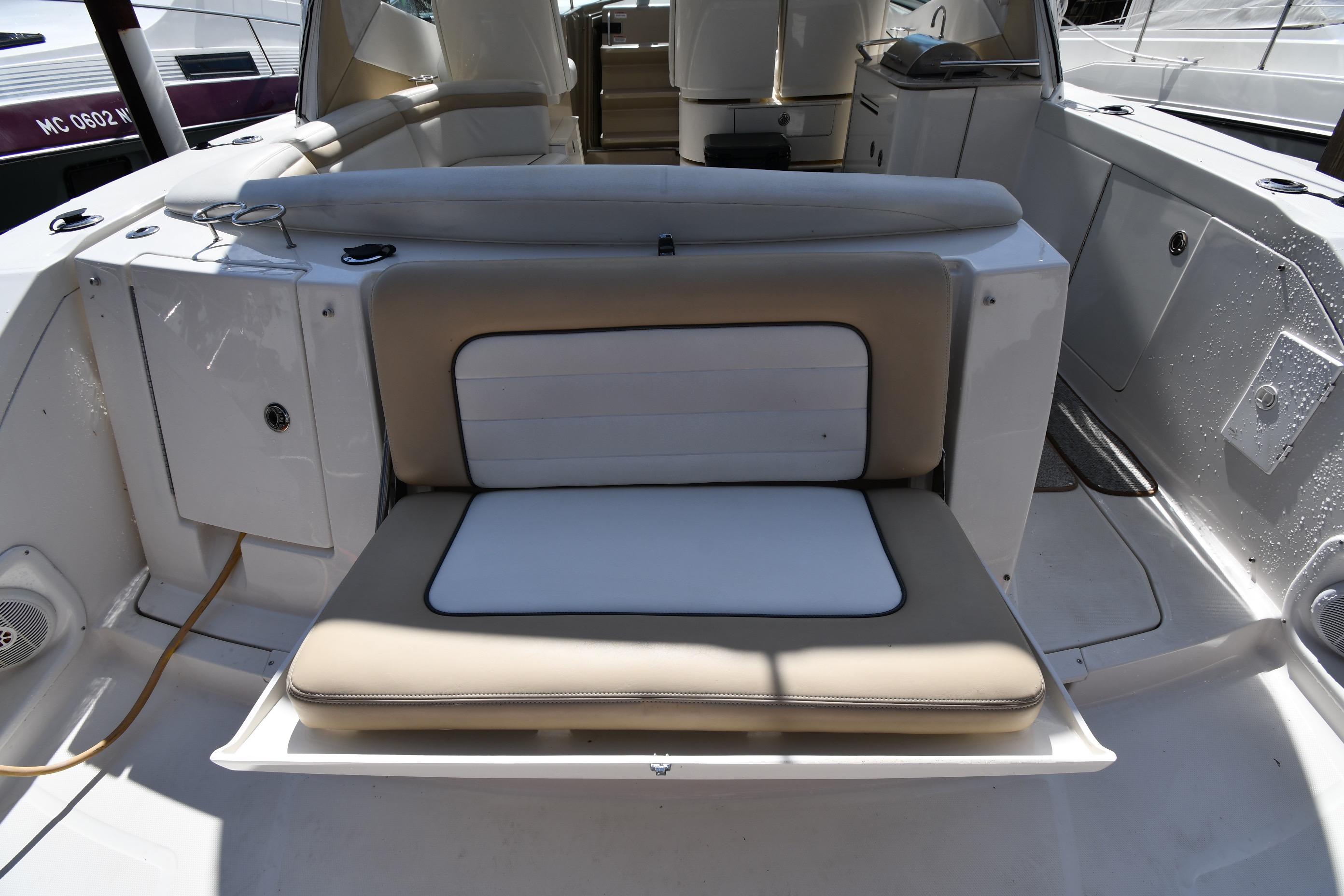 2008 Sea Ray Sundancer 350 boat interior with cushioned seating and storage compartments.