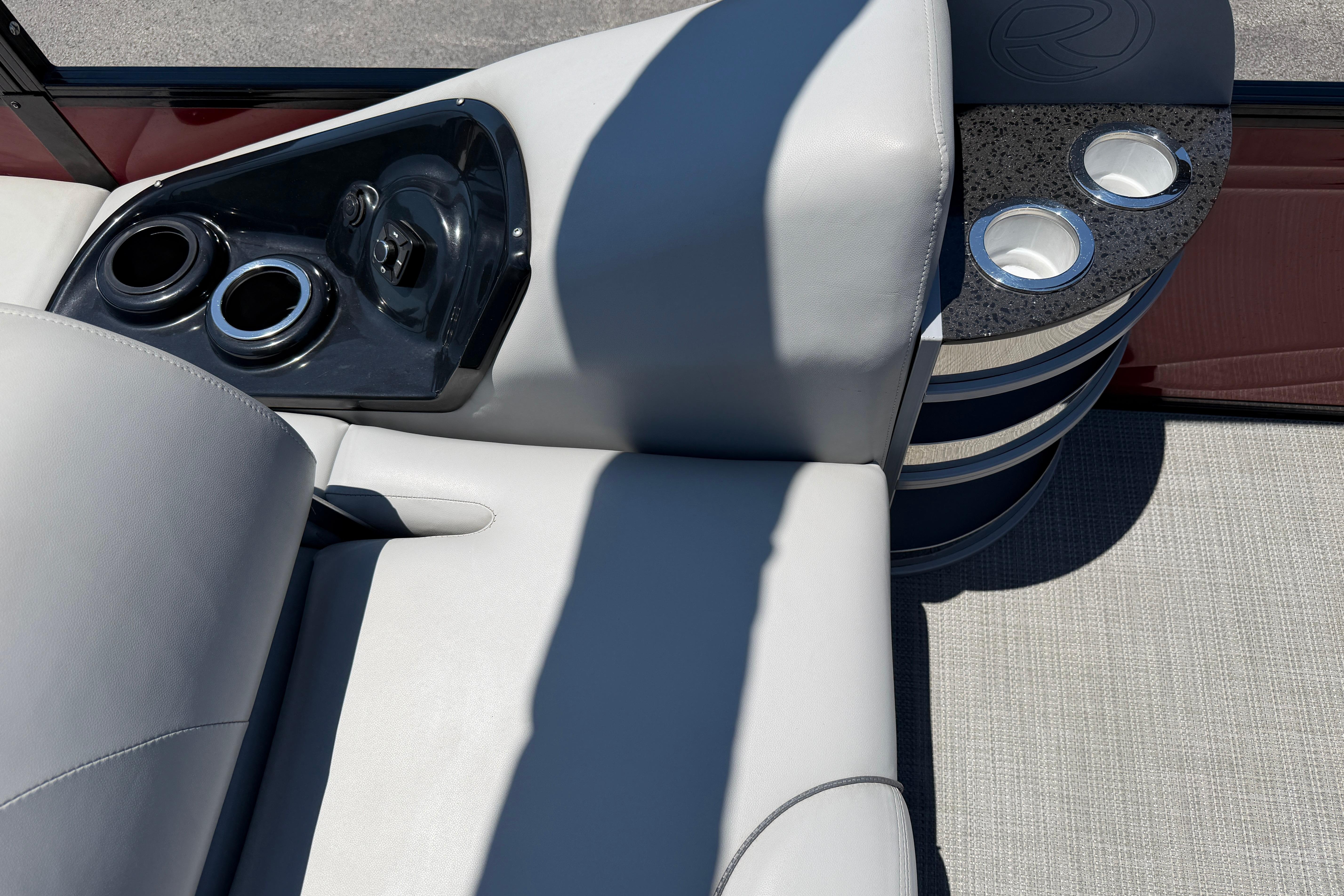 2024 Regency R250DL3 boat interior with cup holders and luxurious seating.
