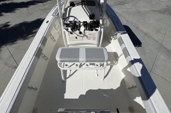2025 Mako 214 Center Console boat interior with steering wheel and seating.