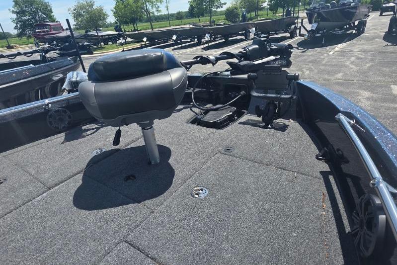 Fishing boat deck with seat, featuring Nitro ZV20 Pro, 2026 model, in a sunny parking lot.