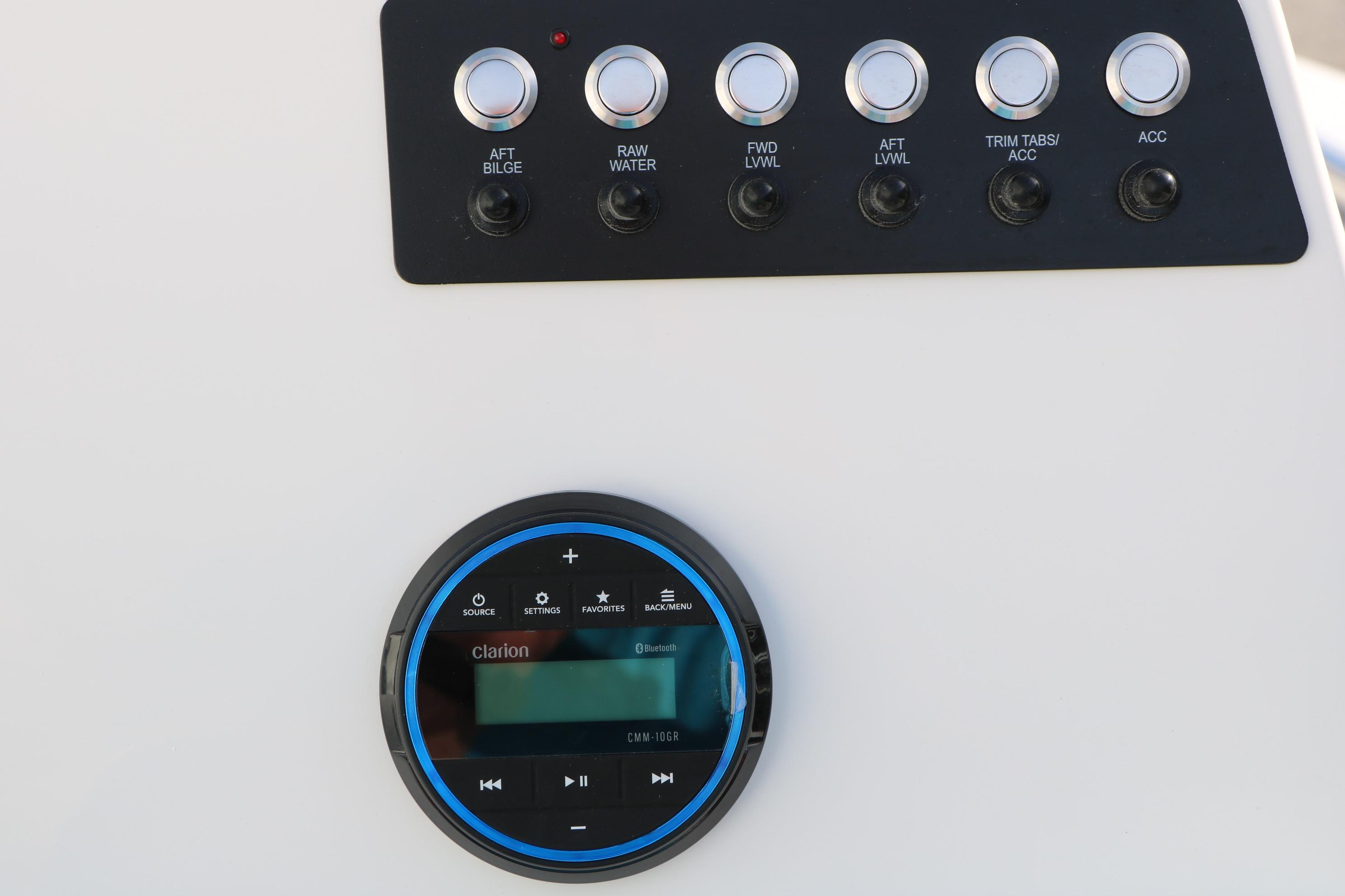 Control panel of 2026 Robalo 206 Cayman boat with Clarion audio system.