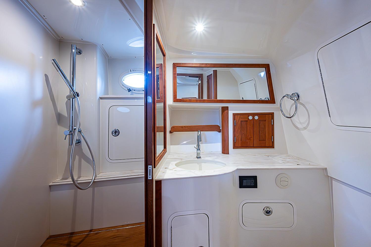 Luxurious bathroom interior of 2023 Hinckley Sport Boat 40 X with modern fixtures.