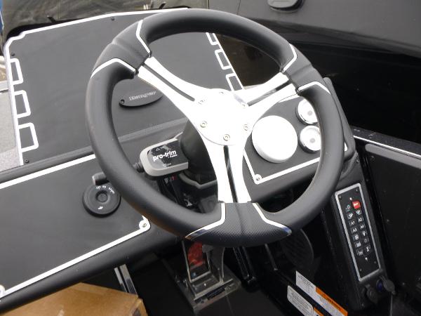 Steering wheel of 2025 Ranger Z521 boat with modern dashboard controls.