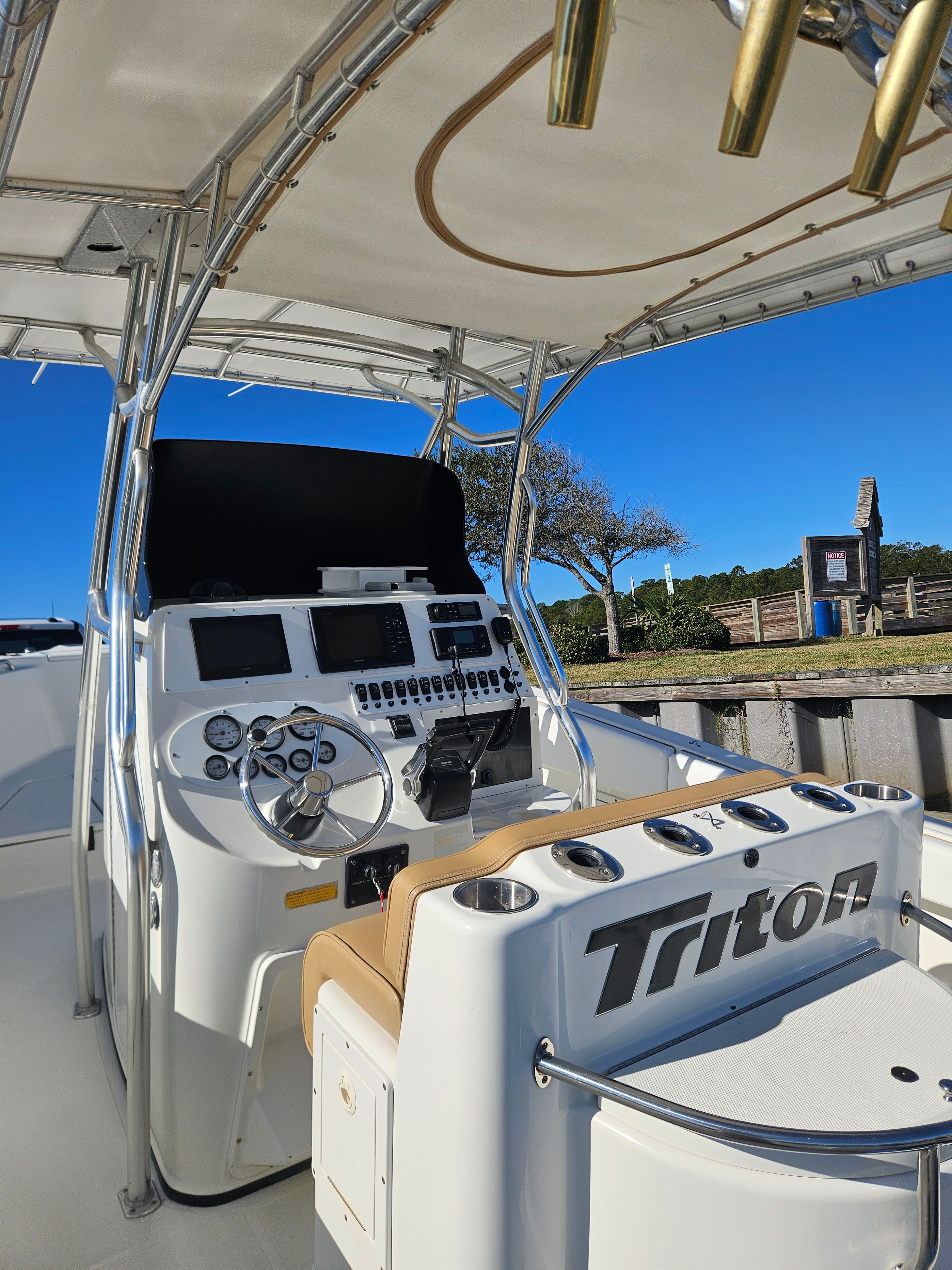 Interior view of a 2004 Triton 2690 CC boat with helm console.