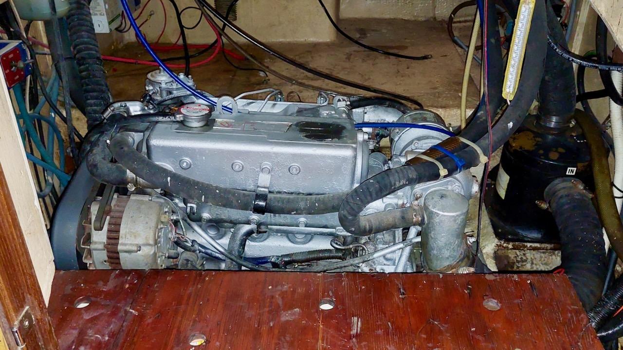 Engine compartment of a 1981 Morgan Out Island 41 sailboat, showing detailed mechanical components.