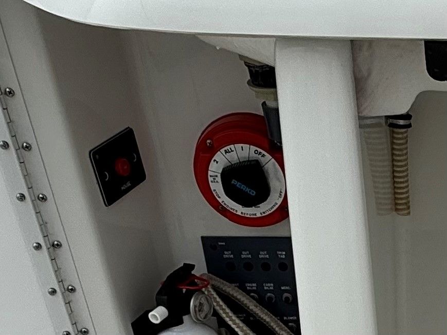 1998 Formula Thunderbird boat control panel with switch and fire extinguisher.