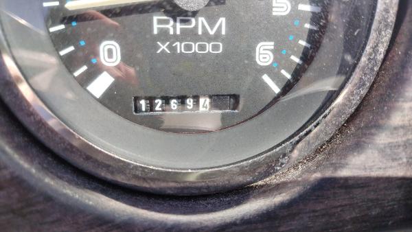 Close-up of a 1999 Chaparral 2130 SS RPM gauge showing 1269.4 hours.