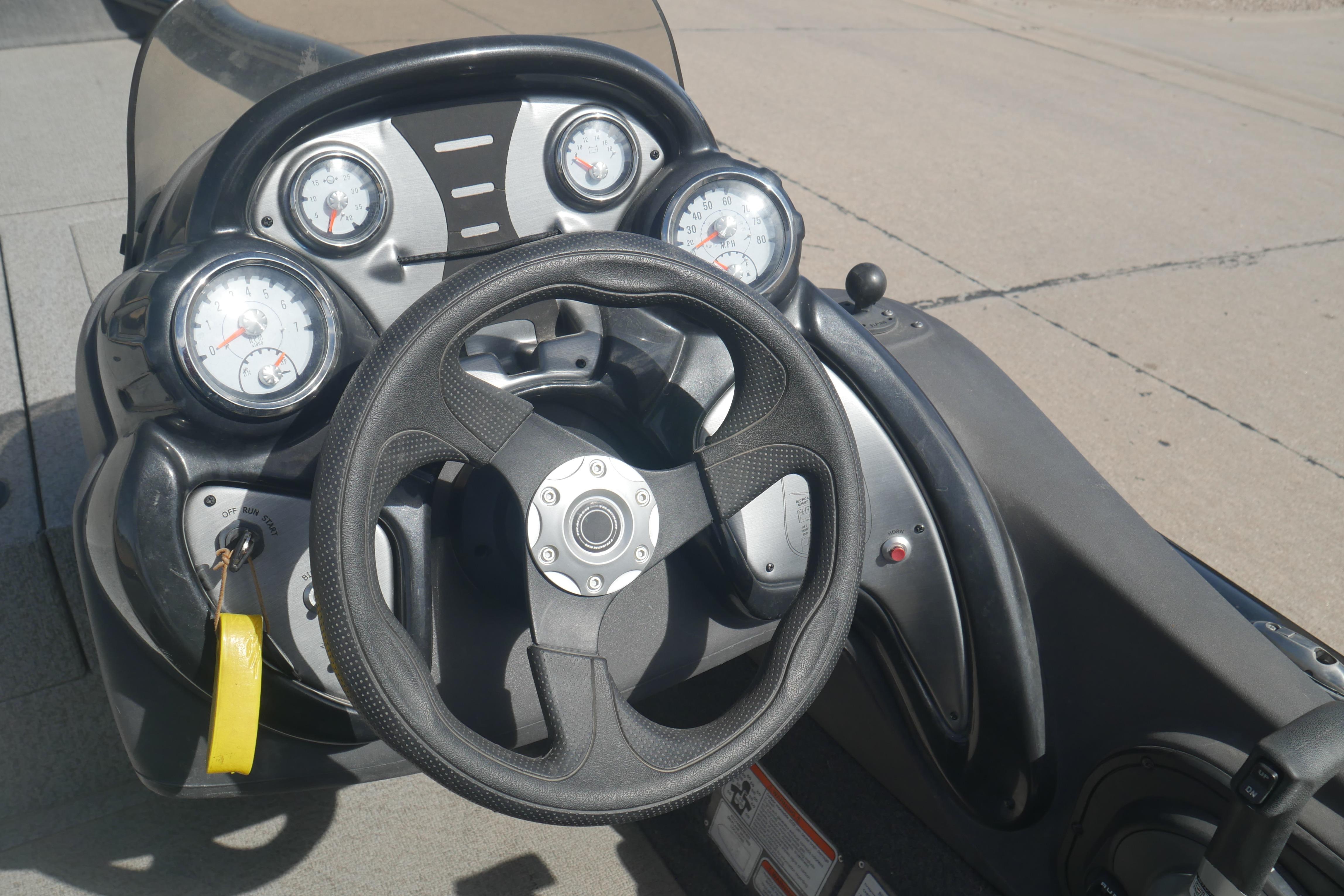 Steering console of 2018 Tracker Pro Team 175 TXW boat with gauges and controls.