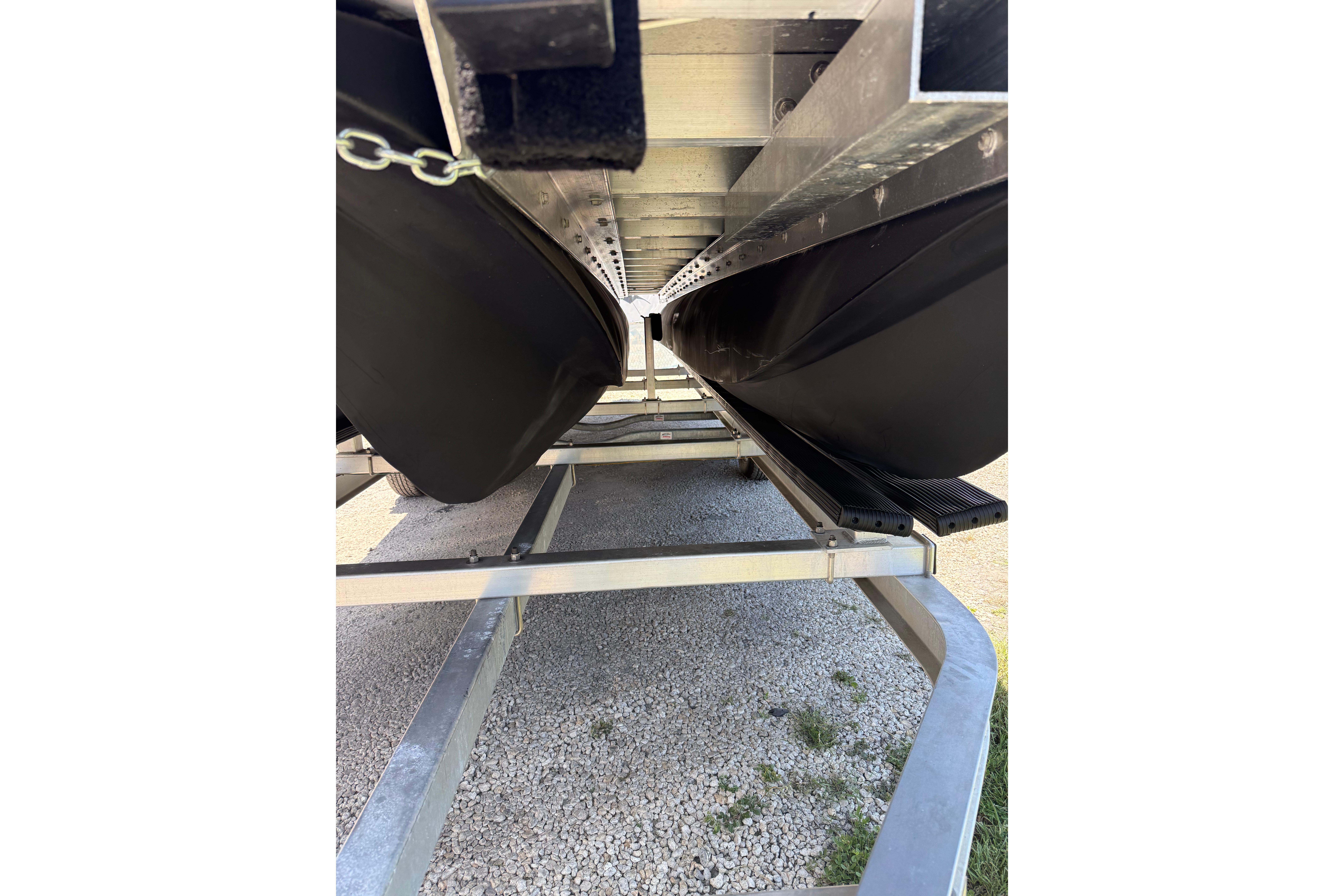Underneath view of a 2026 Tough 20 boat on a trailer.