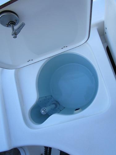 2025 Sea Pro 230 Bay livewell with open lid, showcasing interior design.