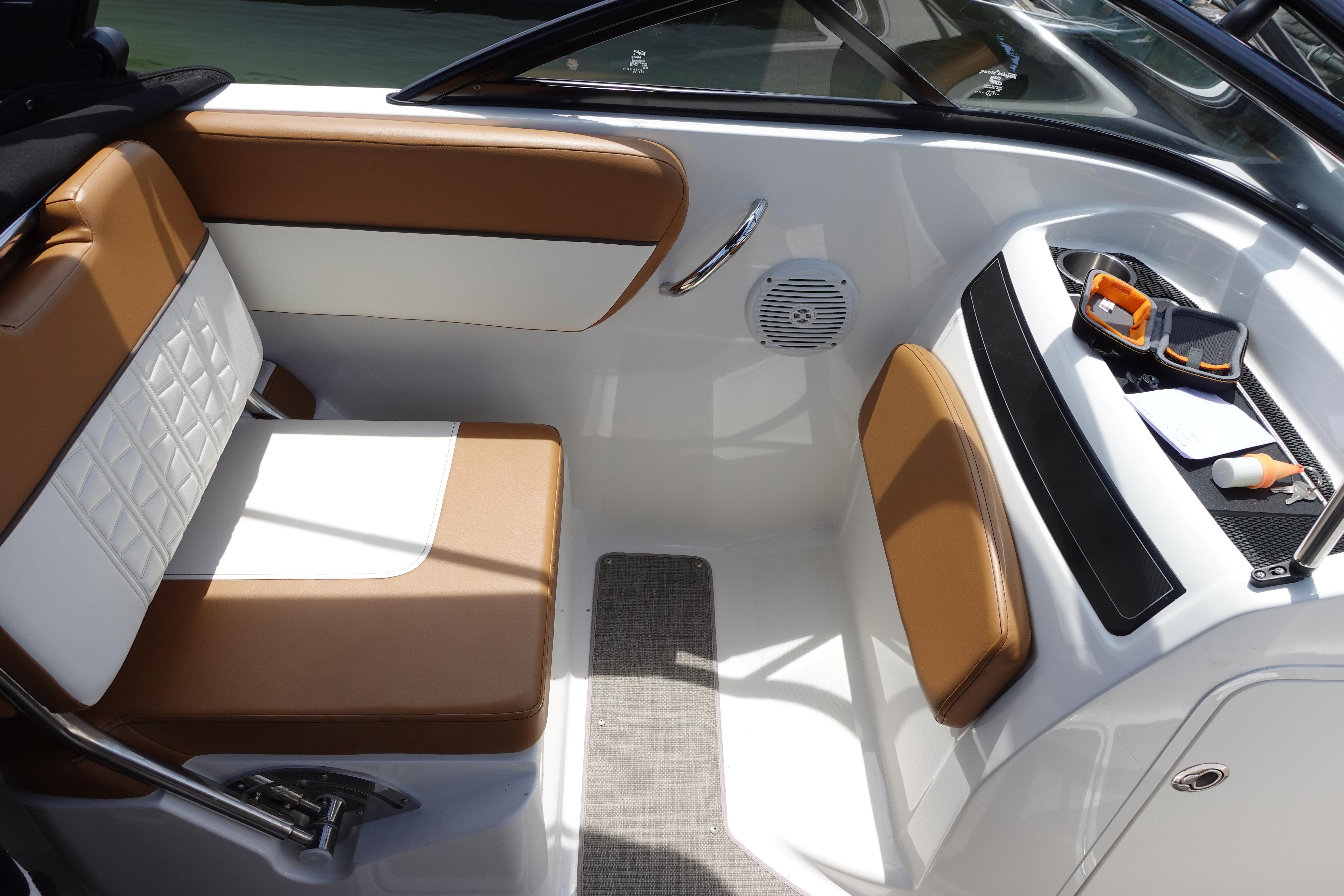 2020 Bayliner VR5 Bowrider OB interior with tan and white seating, storage area.