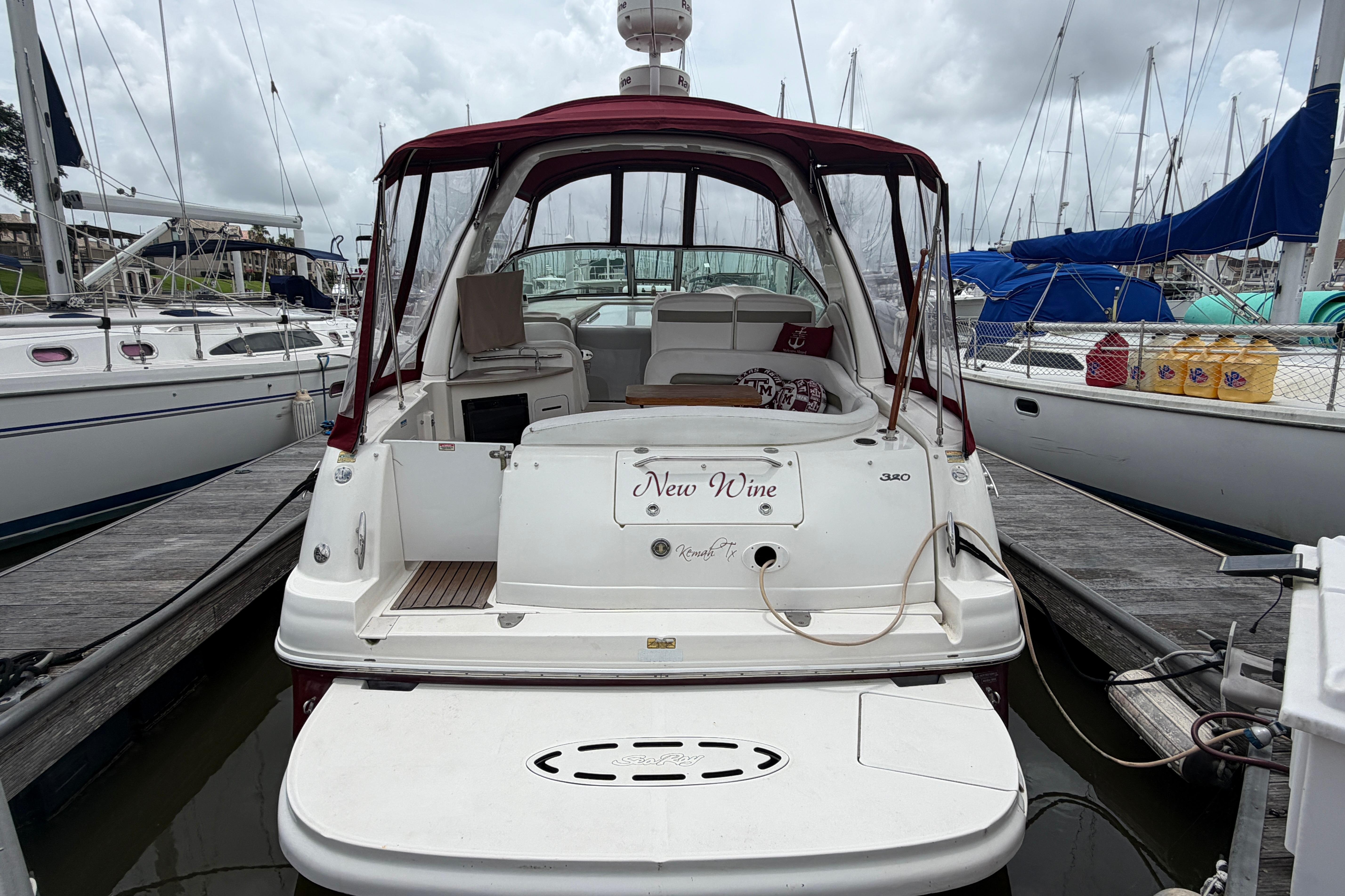 Sea Ray Sundancer 320 boat docked in marina, 2006 model.