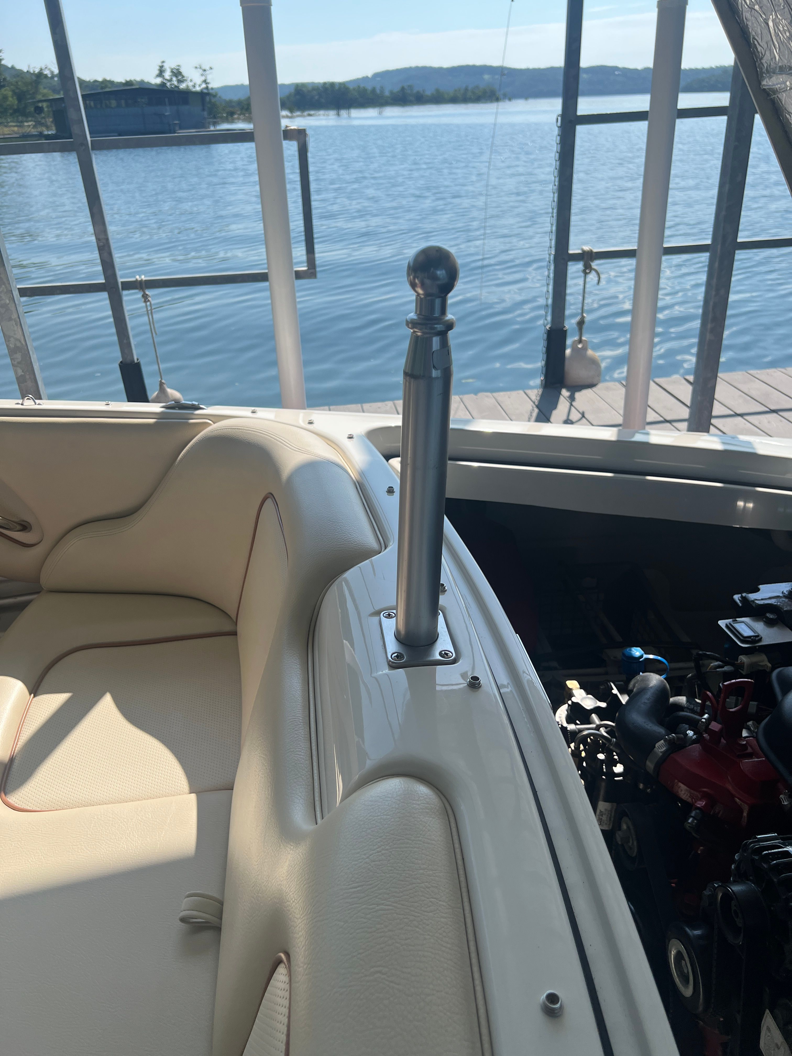 Interior view of a 2006 Chris-Craft Speedster 20 with cream seats and engine.