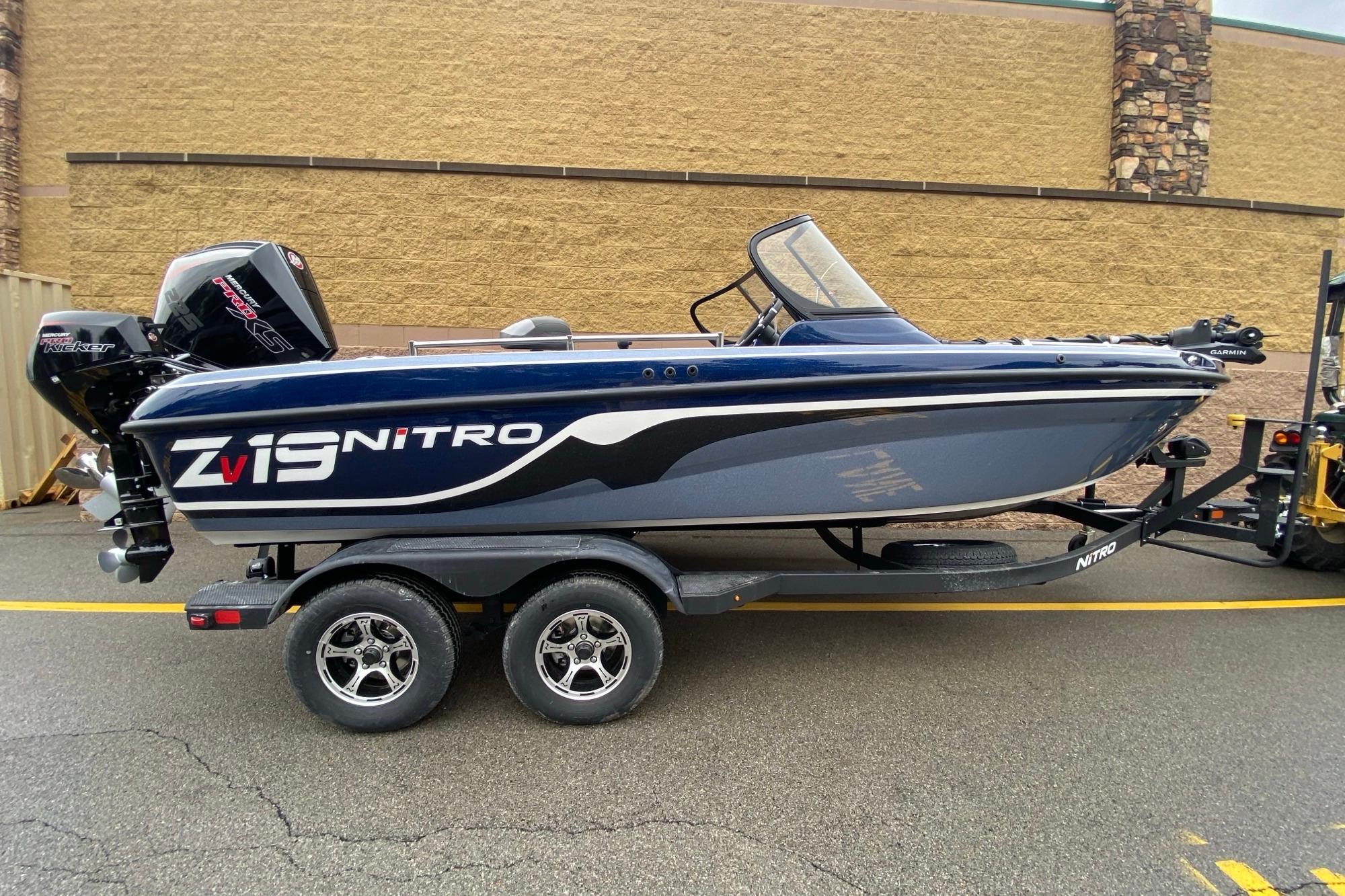 2026 Nitro ZV19 Pro boat on trailer, sleek design, parked outdoors.