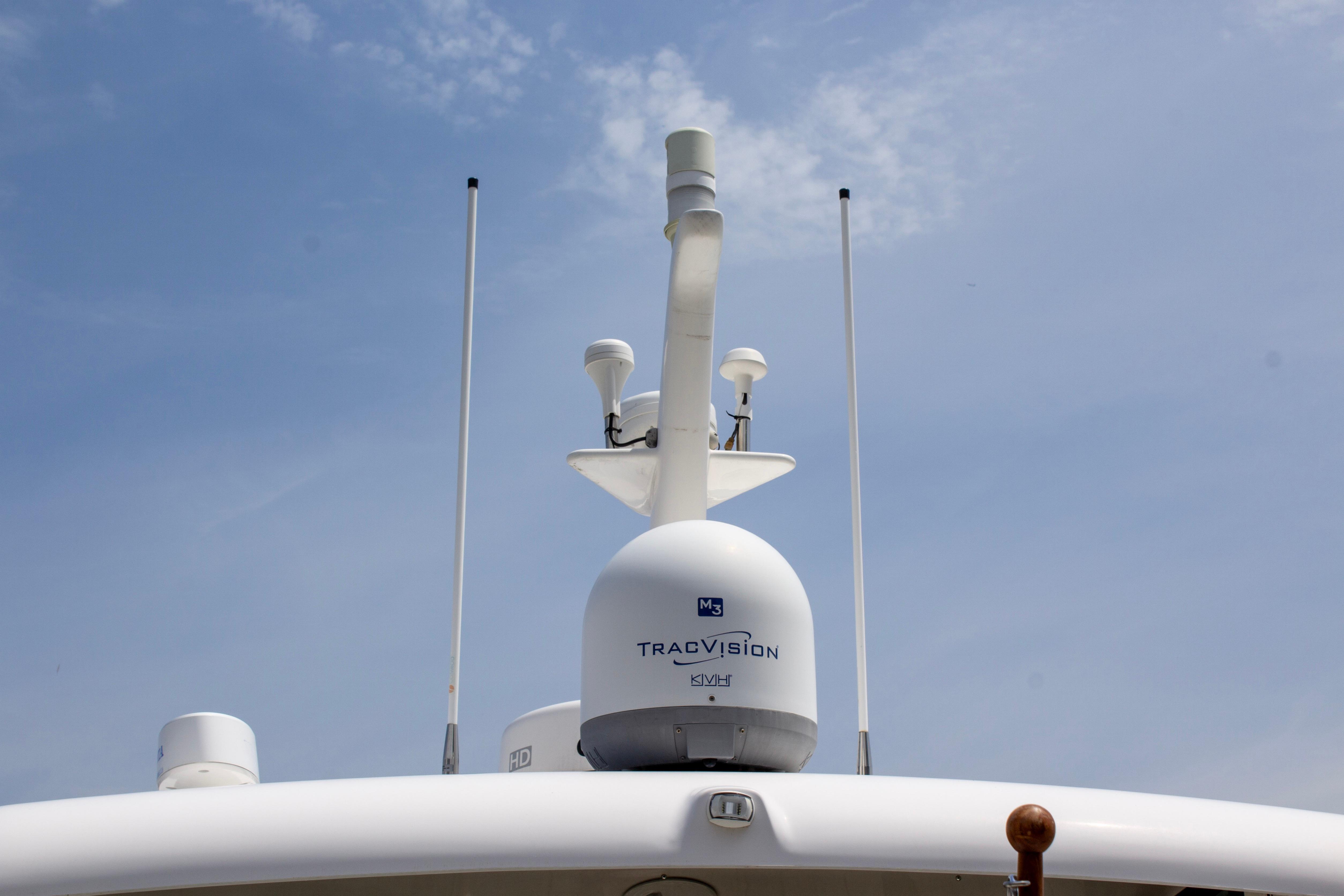 Radar and communication equipment on 2013 Sabre 38 Salon Express yacht under clear sky.