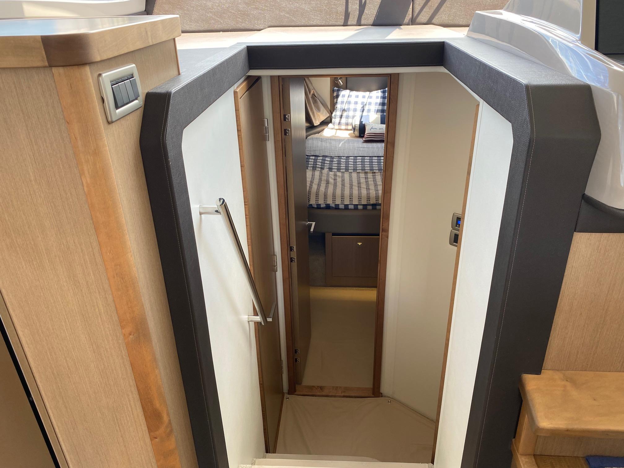Interior view of 2018 Sea Ray 400 Fly yacht cabin entrance.