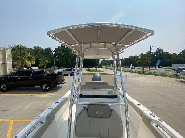 2024 Key West 203 FS boat with T-top in parking lot.