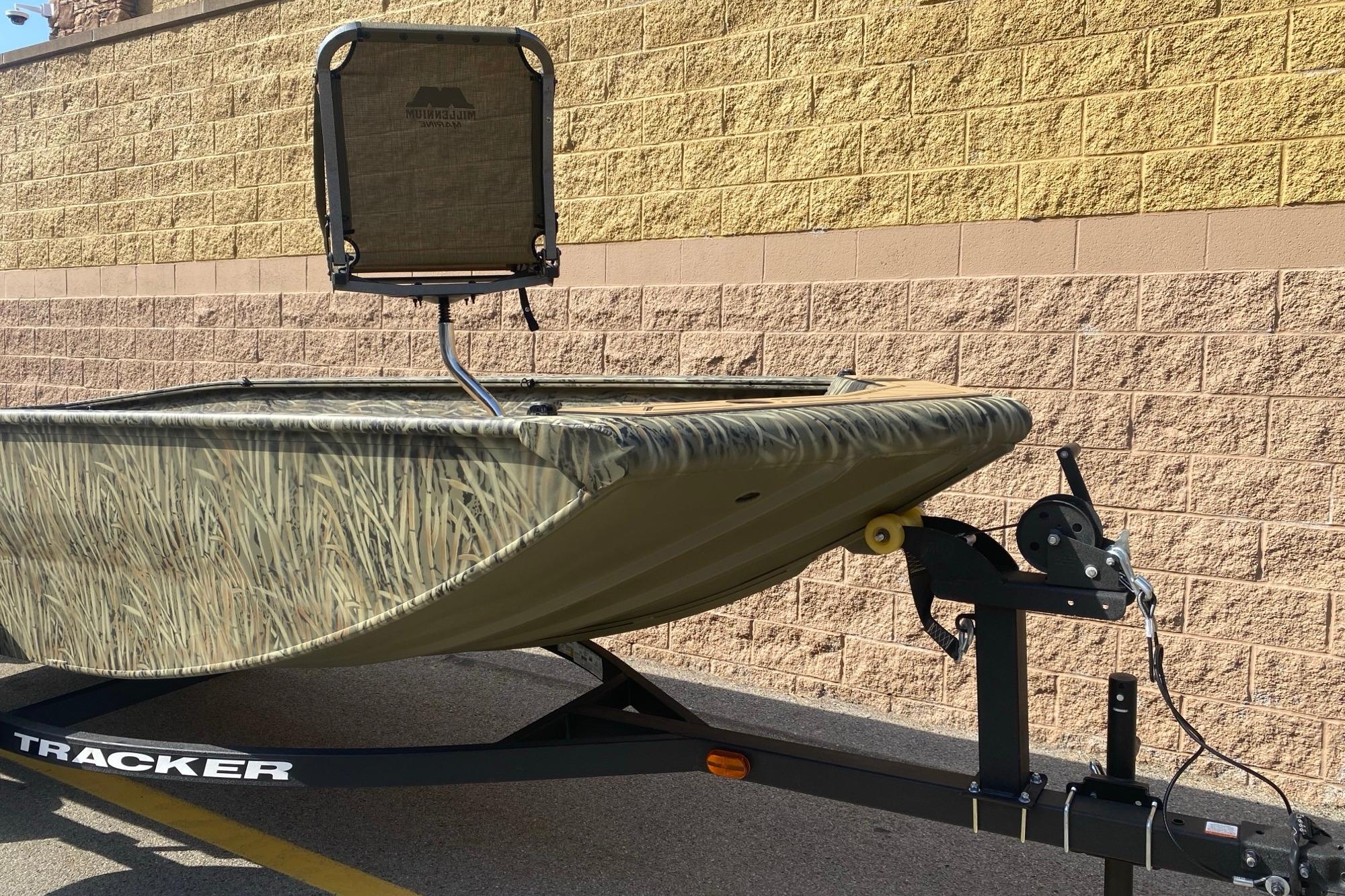 2026 Tracker Grizzly 1650 T Prairie Wings Edition boat on trailer, camo design.