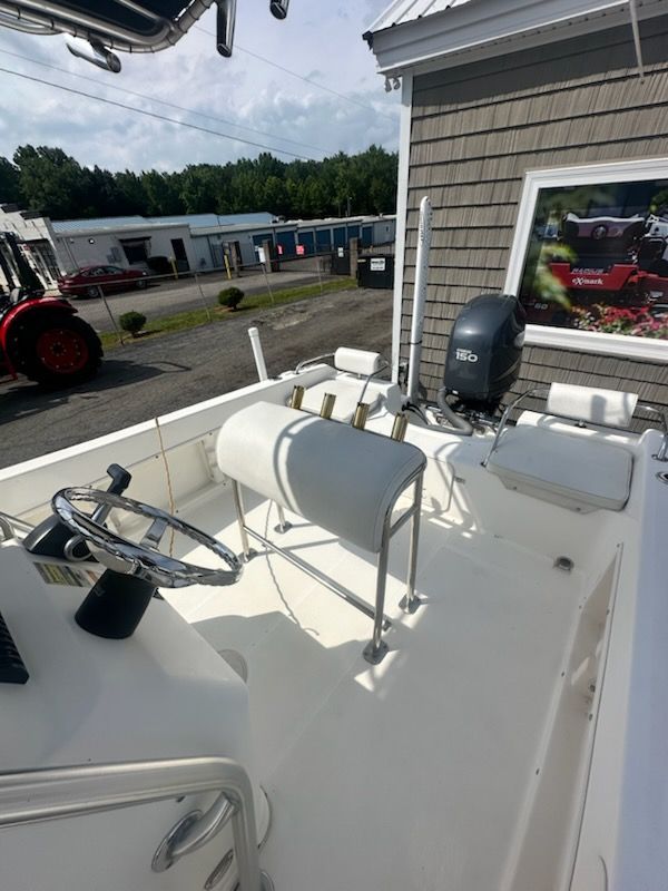 The image shows the cockpit of a 2009 Century 2001 Center Console boat with helm and seating.