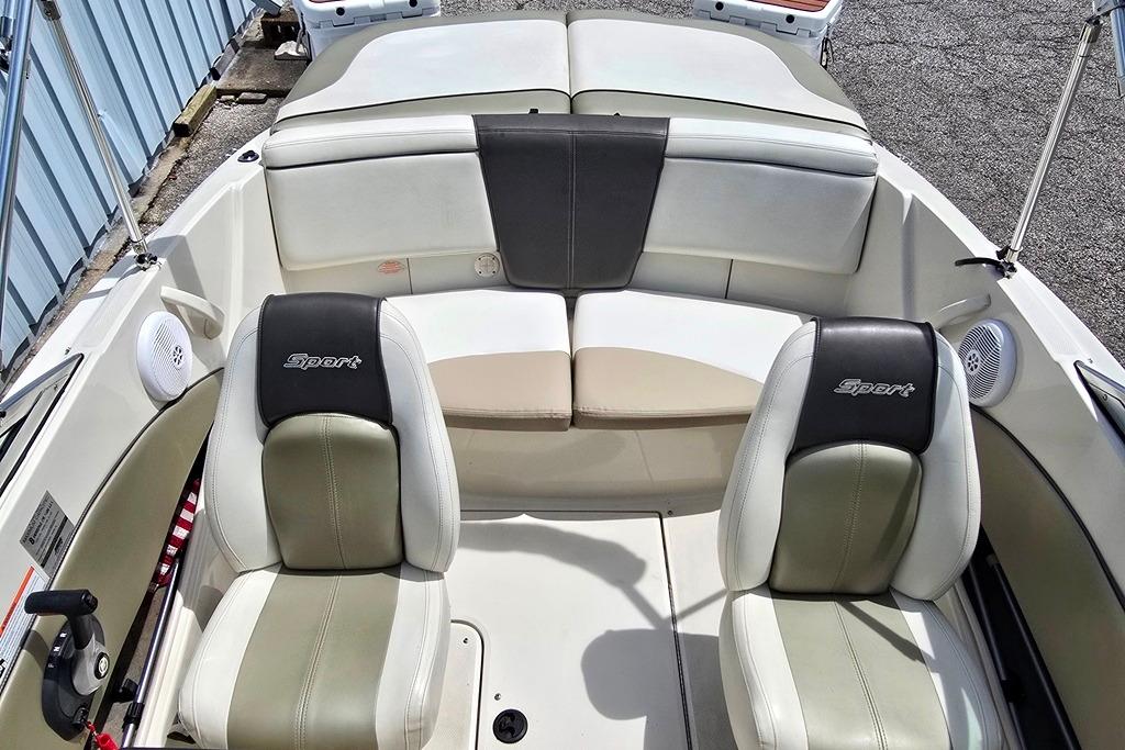 2006 Sea Ray 185 Sport boat interior with two seats and rear bench.