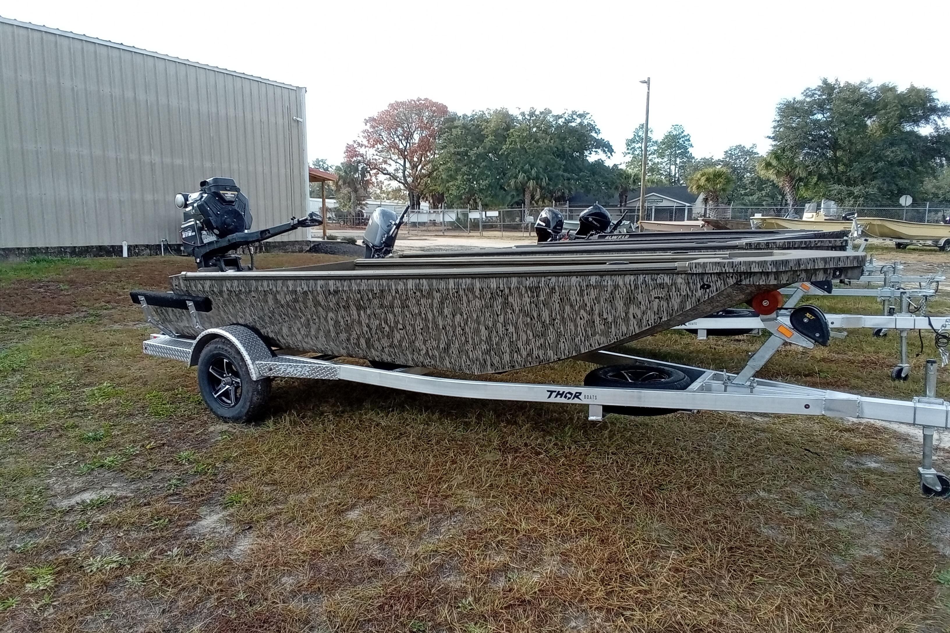 2026 Thor 1754 Swamp Hammer boat on trailer, parked outdoors.