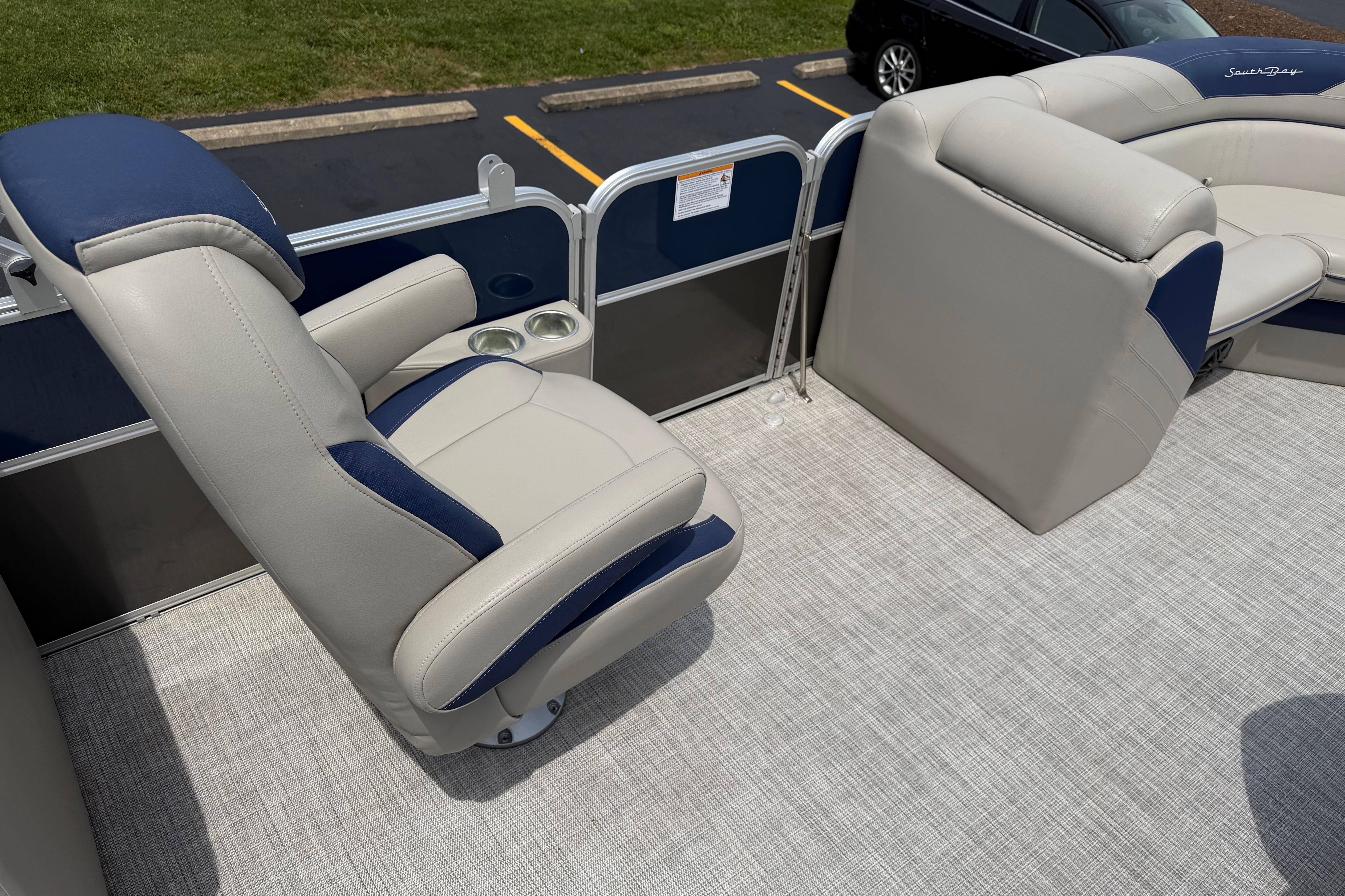 2021 South Bay 224RS LE boat interior with plush seating and cup holders.
